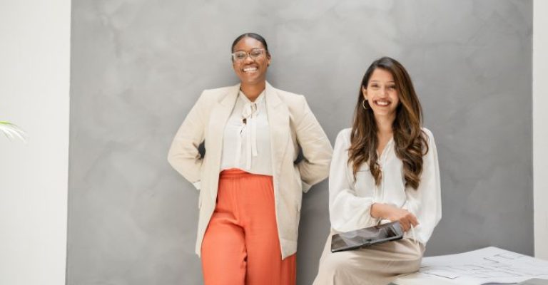 Two women smiling